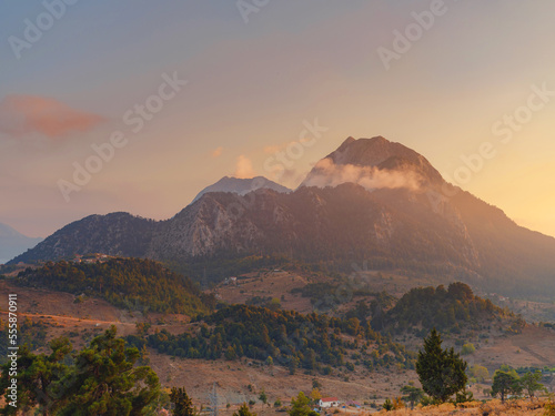 Turkey travel  mediterranean area on a warm summer day  sunset over mountains and valley under Kemer  Antalya province. Lycian trail