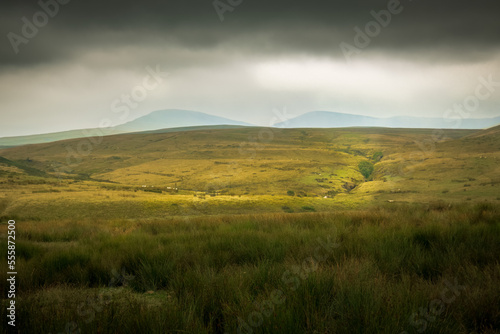 The moody landscape of the Brecon Beacons National Park in Wales, UK just beform a storm.