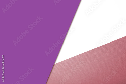 Plain vs textured coloured papers intersecting to form a triangle shape for cover design
