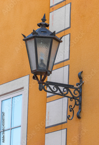 old style lantern on wall .