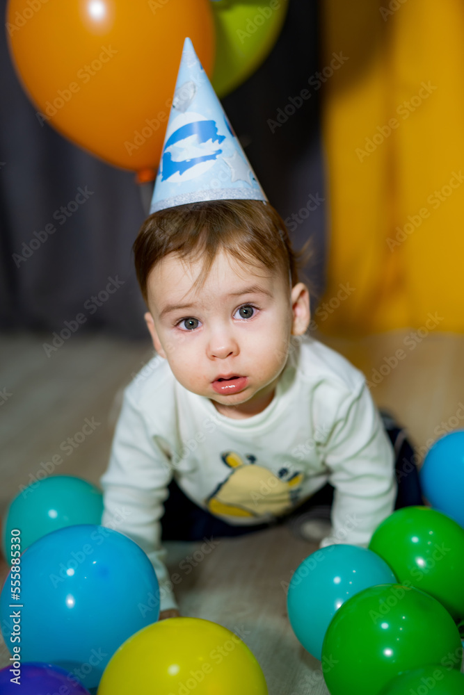 Obraz premium Babies First Birthday. One year old with colorful balloons. The boy's birthday.