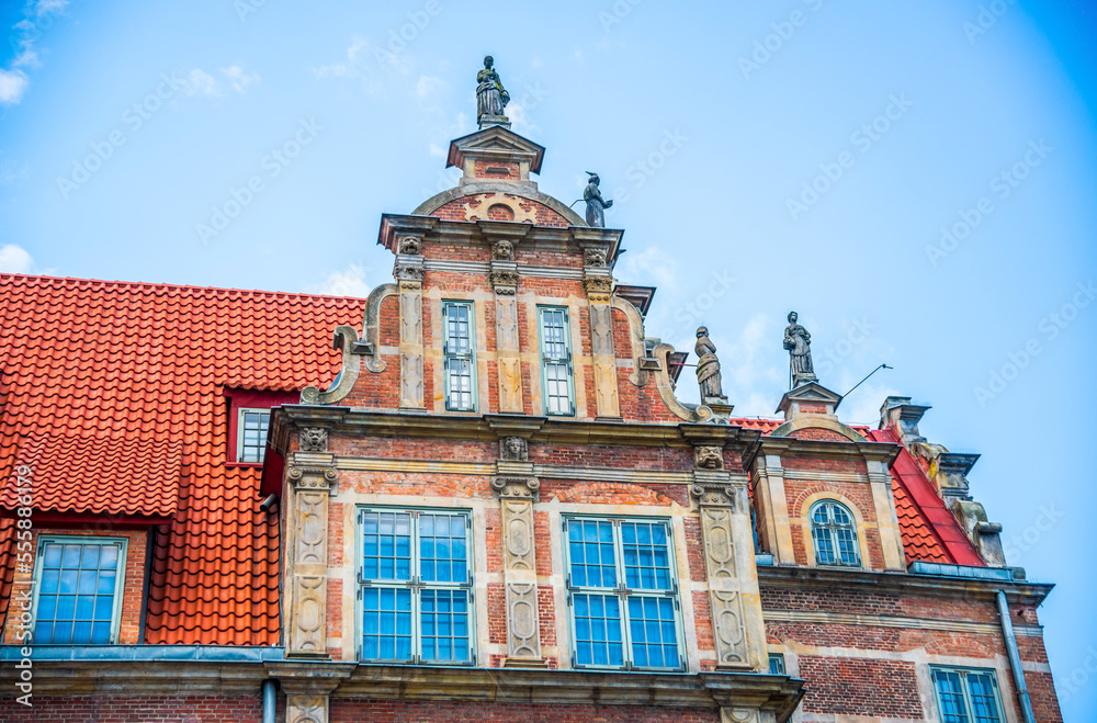Facade of beautiful typical colorful houses buildings in old historical town Gdansk (Danzig), Poland