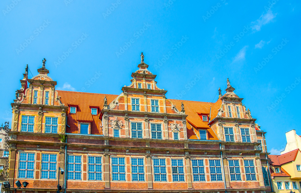 Facade of beautiful typical colorful houses buildings in old historical town Gdansk (Danzig), Poland