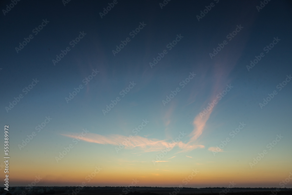 Obraz premium sunset sky with multicolor clouds. Dramatic twilight sky background