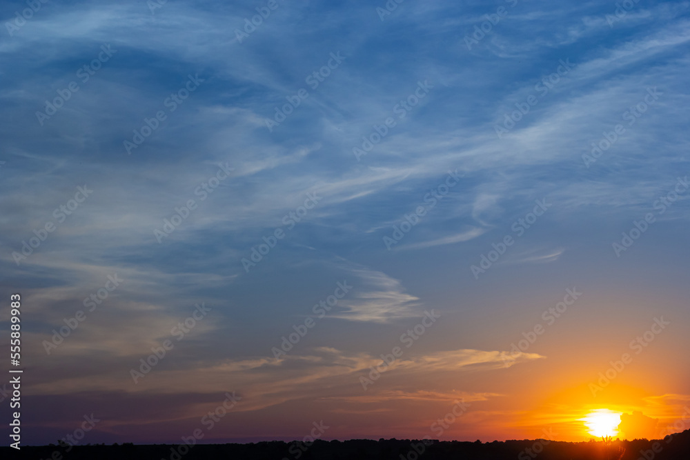 sunset sky with multicolor clouds. Dramatic twilight sky background