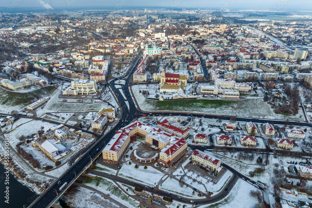 winter panoramic aerial view of a huge residential complex with high-rise buildings and private sector with snow
