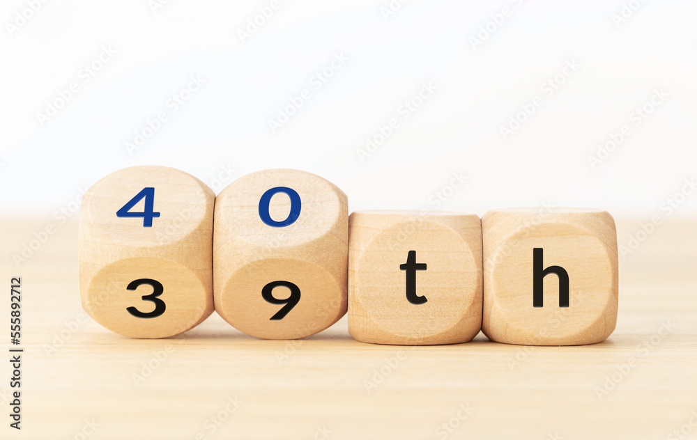 Turning 40 years old concept. Text on wooden blocks and changing dices Turning 40 years old concept. Text on wooden blocks and changing dices