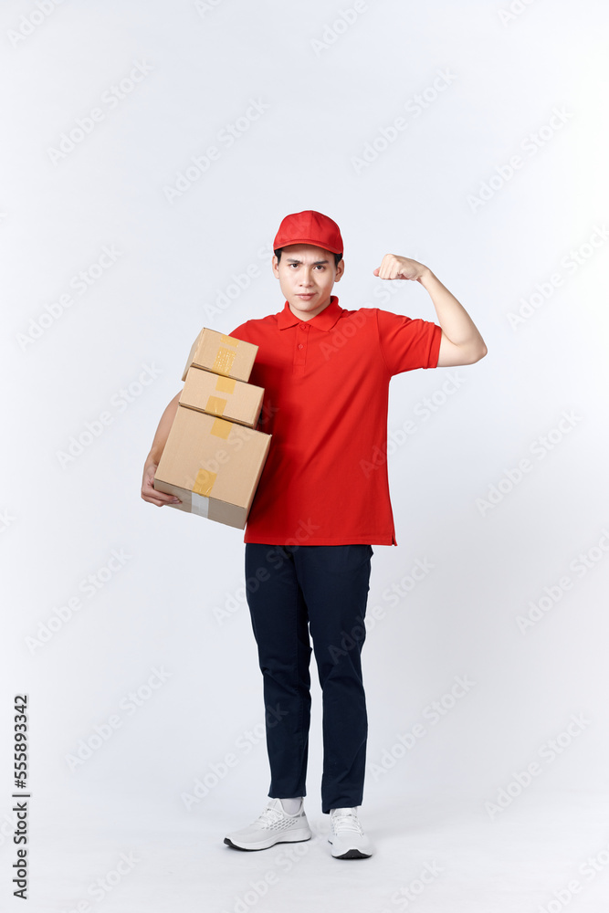 Portrait of Strong handsome delivery man flexing his muscle and holding pizza box packages. Portrait of Strong handsome delivery man flexing his muscle and holding pizza box packages.