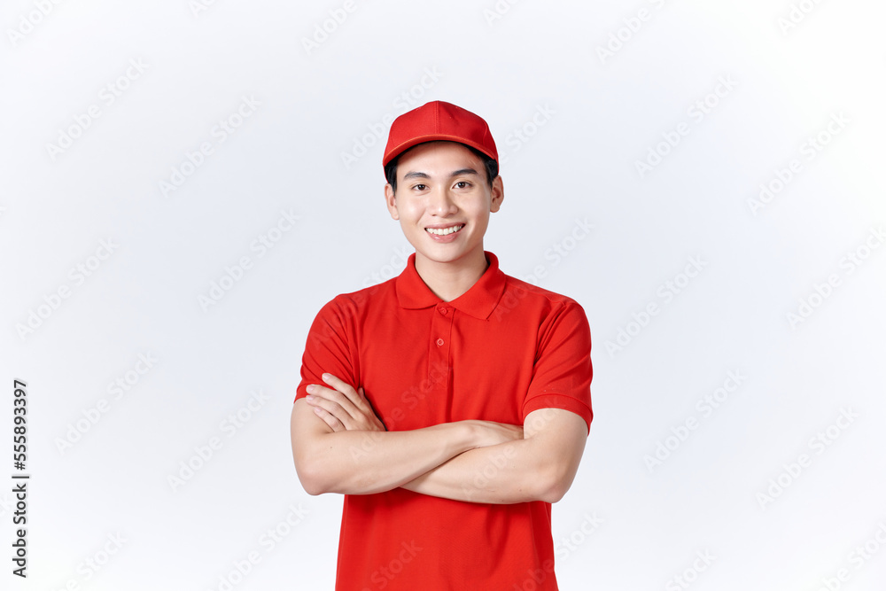 Professional smiling confident male employee in cap, t-shirt courier dealer holding hands crossed folded Professional smiling confident male employee in cap, t-shirt courier dealer holding hands crossed folded