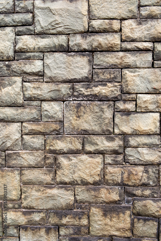 Old dressed stone industrial building wall full frame texture background