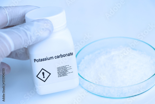 Schilderij op canvas Potassium carbonate in bottle , chemical in the laboratory and industry