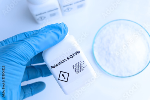 Potassium sulphate in bottle , chemical in the laboratory and industry photo