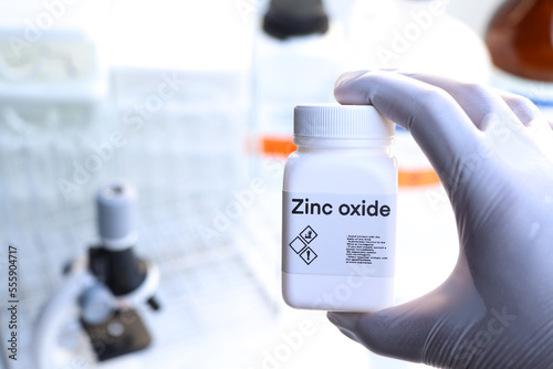 zinc oxide in bottle , chemical in the laboratory and industry photo