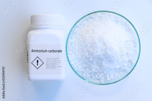 Ammonium carbonate in bottle , chemical in the laboratory and industry photo