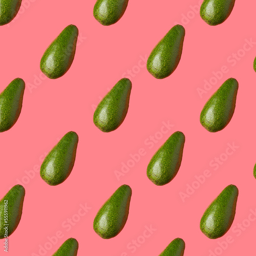 Avocado pattern on pink background. Top view.