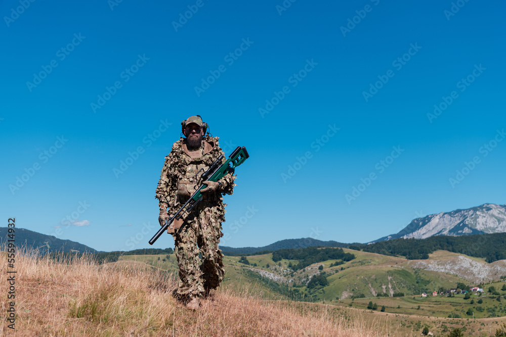 Army soldier holding a sniper rifle with scope and walking in the forest. war, army, technology and people concept. Army soldier holding a sniper rifle with scope and walking in the forest. war, army, technology and people concept.