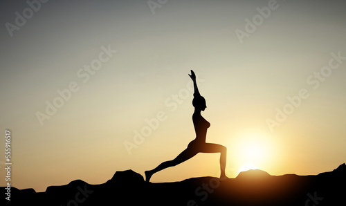 Silhouette of a beautiful Yoga woman in the morning  © NOTE OMG