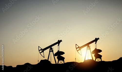 Oil pump oil rig energy industrial machine for petroleum in the sunset background for design 