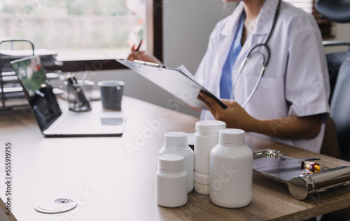 Homecare nursing service and elderly people cardiology healthcare. Close up of young hispanic female doctor nurse check mature caucasian man patient heartbeat using stethoscope during visit