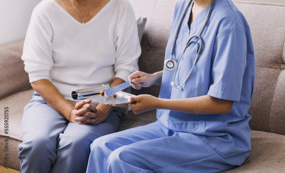 Homecare nursing service and elderly people cardiology healthcare. Close up of young hispanic female doctor nurse check mature caucasian man patient heartbeat using stethoscope during visit