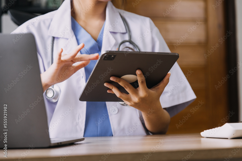 Homecare nursing service and elderly people cardiology healthcare. Close up of young hispanic female doctor nurse check mature caucasian man patient heartbeat using stethoscope during visit Homecare nursing service and elderly people cardiology healthcare. Close up of young hispanic female doctor nurse check mature caucasian man patient heartbeat using stethoscope during visit