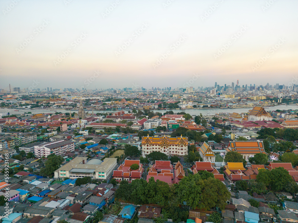 Aerial view Bangkok city buddhist temple with river sunset sky