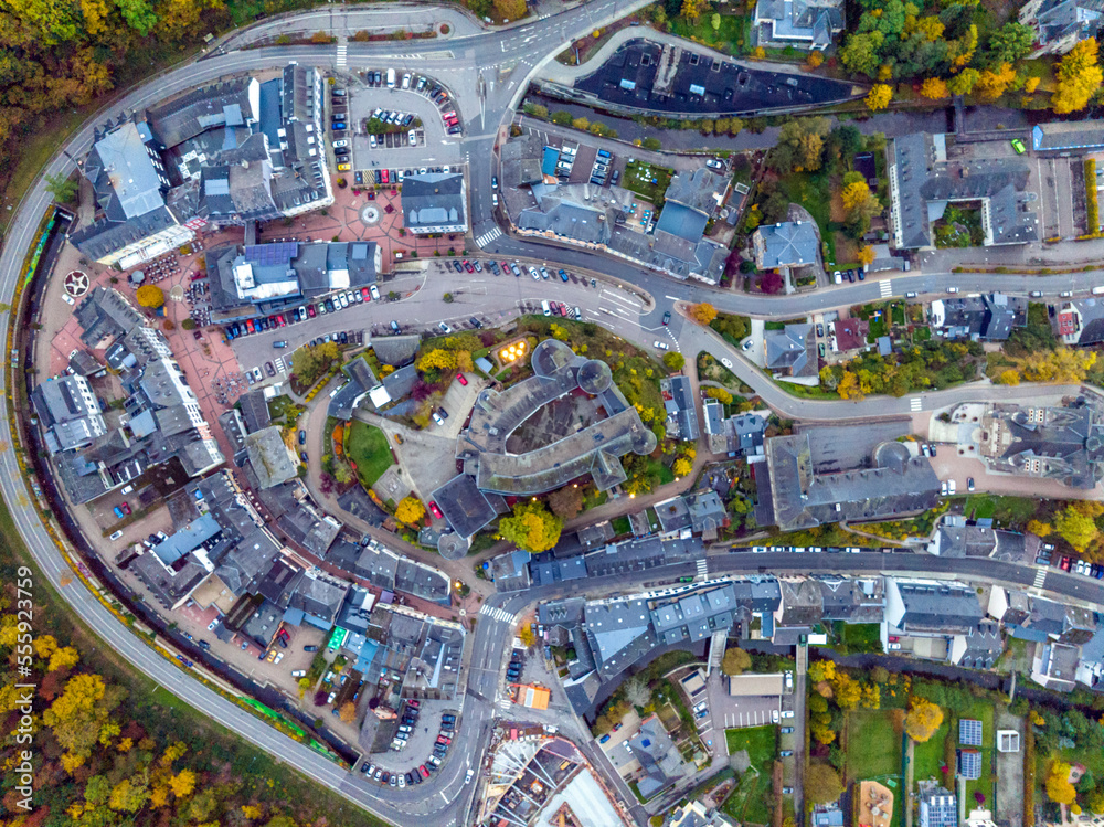 Fototapeta premium Aerial drone Shot of town CLervaux on the north of Luxembourg. Twilight evening scene with Castle and Cathedral