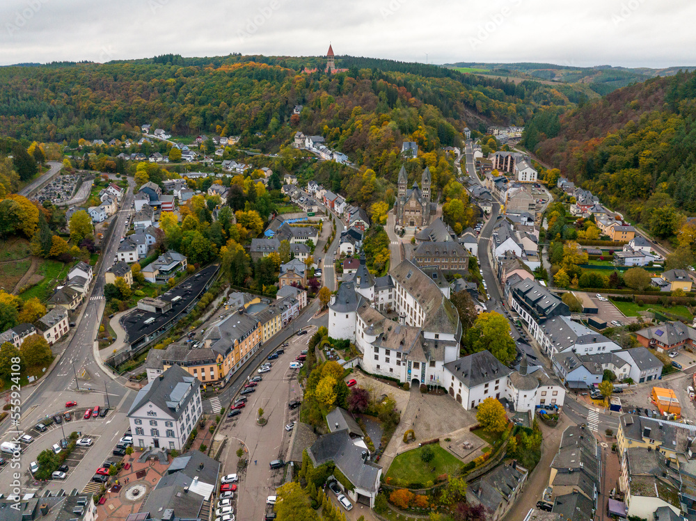 Aerial drone Shot of town CLervaux on the north of Luxembourg. Twilight evening scene with Castle and Cathedral