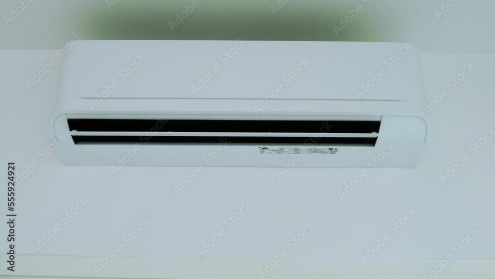 Man turn off on the air conditioner. Man turn off on the air conditioner.