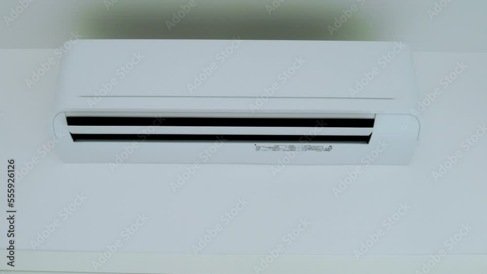 Man turn off on the air conditioner. Man turn off on the air conditioner.