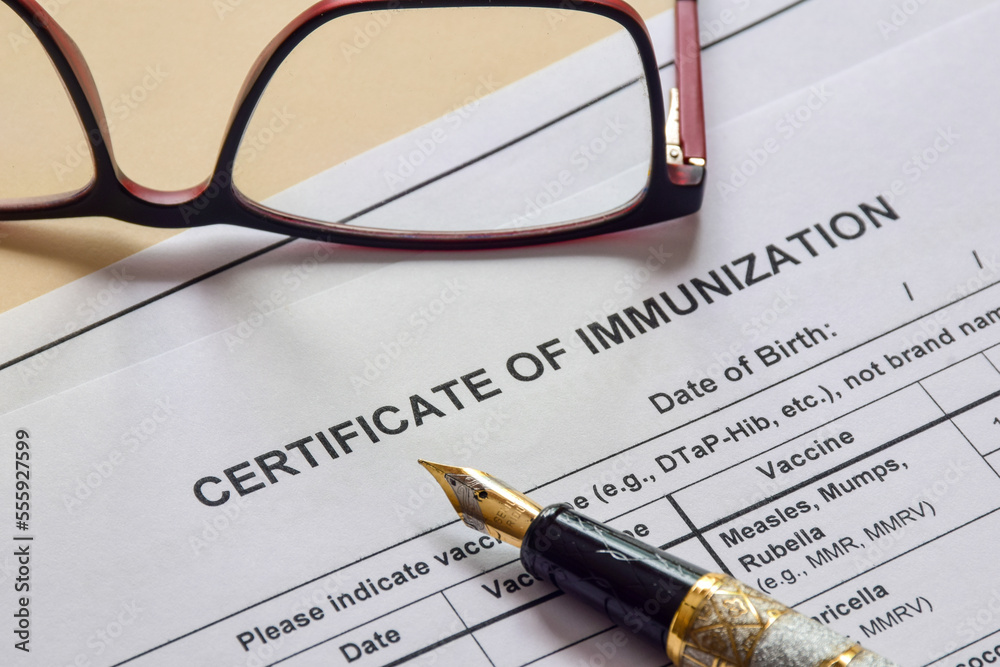 Close up of certificate of immunization form on desk. Selective focus. Close up of certificate of immunization form on desk. Selective focus.
