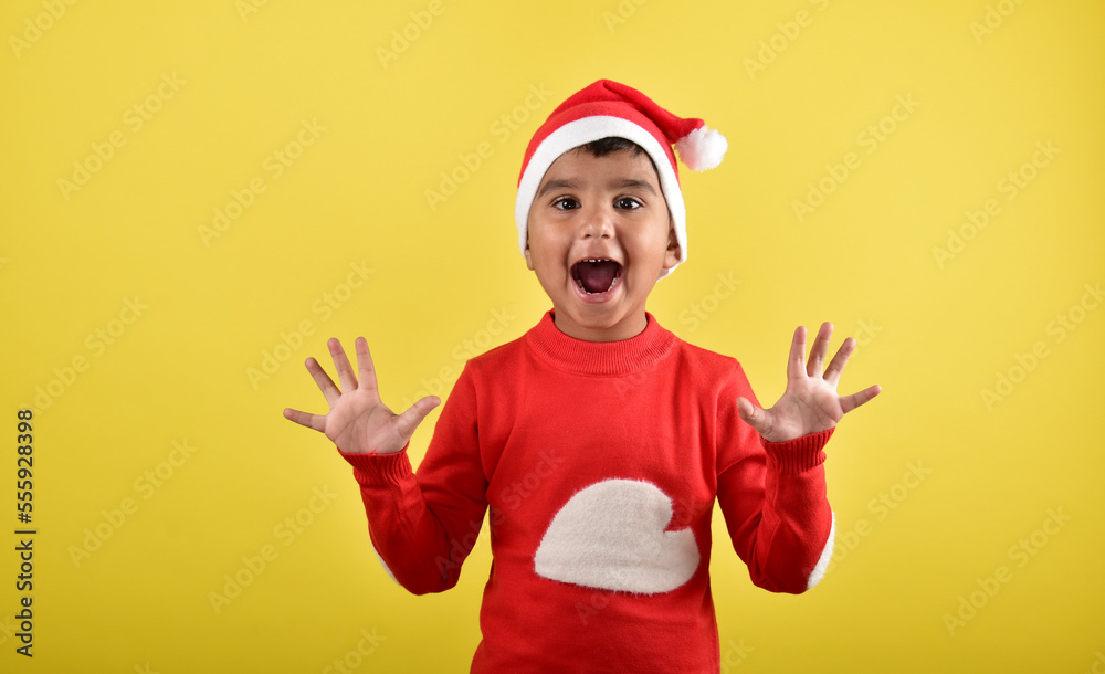 child boy wearing santa cap