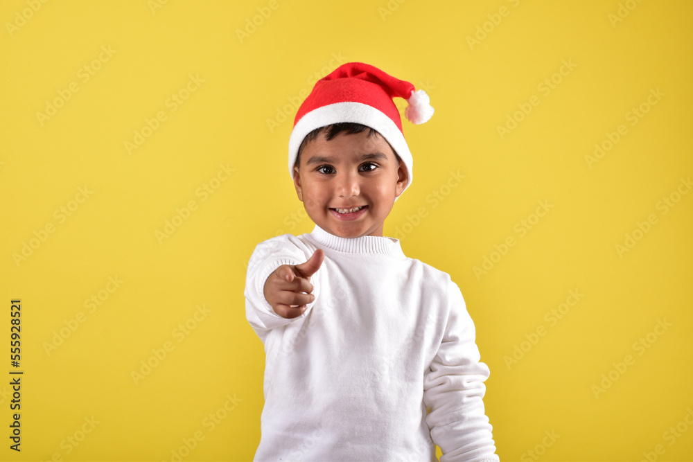 child boy wearing santa cap 