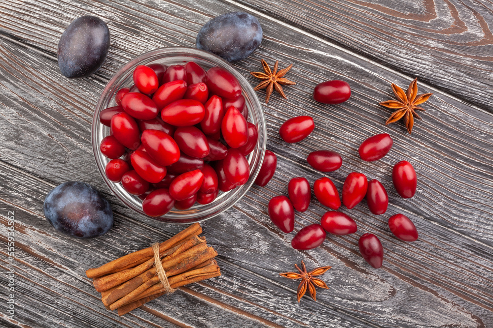 cornelian cherry on wood background top view cornelian cherry on wood background top view