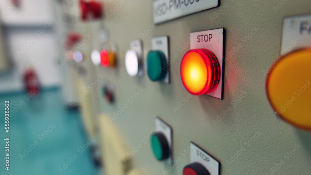 Control buttons and light indicating the work status installed in front of the electric control cabinet installed in the electric control room. Automatic Industry Concept Energy and industrial use