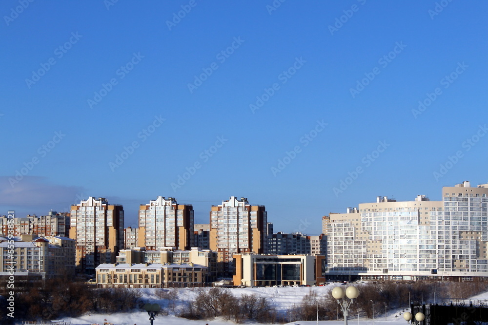 .Winter cityscape with houses on a sunny frosty day.