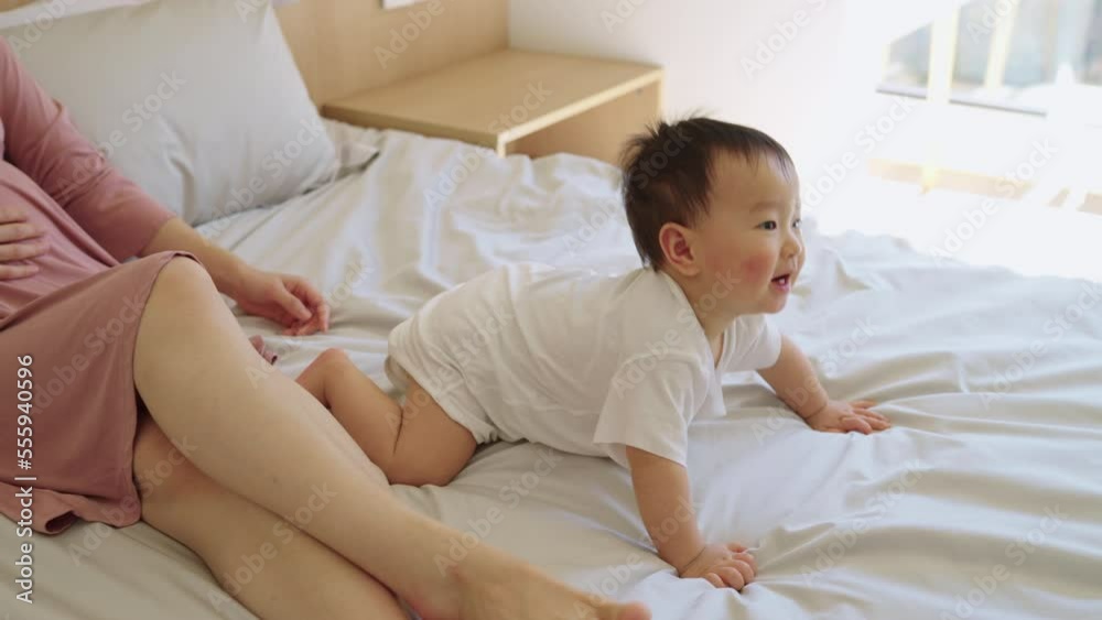 Young pregnant Chinese woman with her child Young pregnant Chinese woman with her child