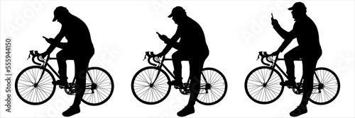 A cyclist reads  writes messages on his mobile phone  and takes pictures of himself while sitting on a bicycle. A guy in a cap sits on a bicycle frame. Three black male silhouettes isolated on white