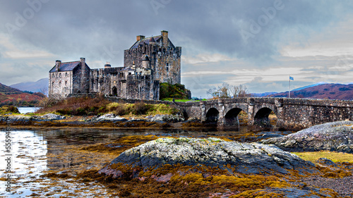 Landscape view of Eilean Donan Castle in the Scottish Highlands with Autumnal colour