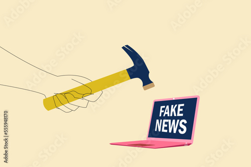 hammer destroy fake news in laptop. Concept of stop fake news and misinformation spreading on internet and media.