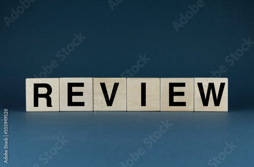 Review. The cubes form the word Review. The extensive concept of the word Review