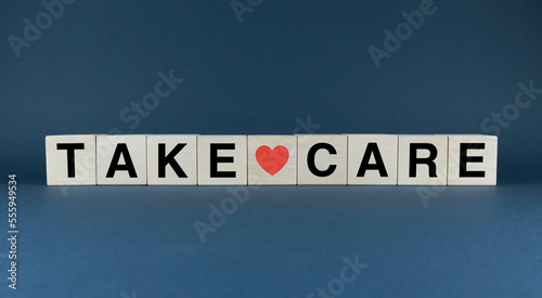 Take Care. The cubes form the word Take Care