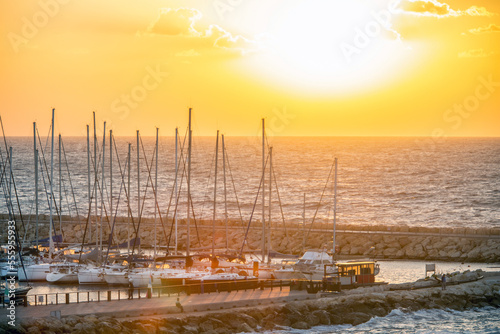 Sailboats in harbor in sunset or sunrise in Tel Aviv