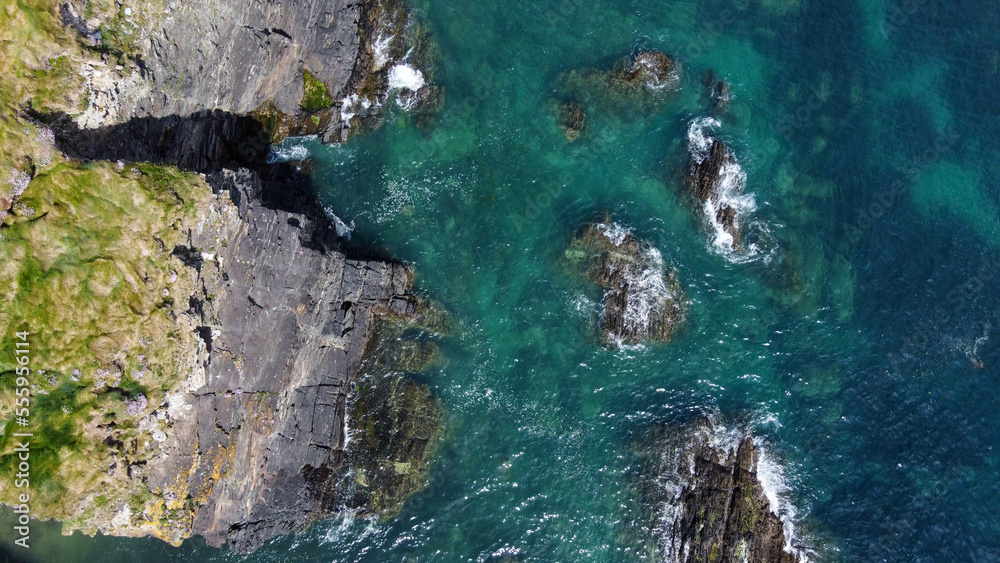 Epic cliffs of Ireland. The picturesque coast of the Celtic Sea, West Cork. Seascape, top view. Aerial photo.