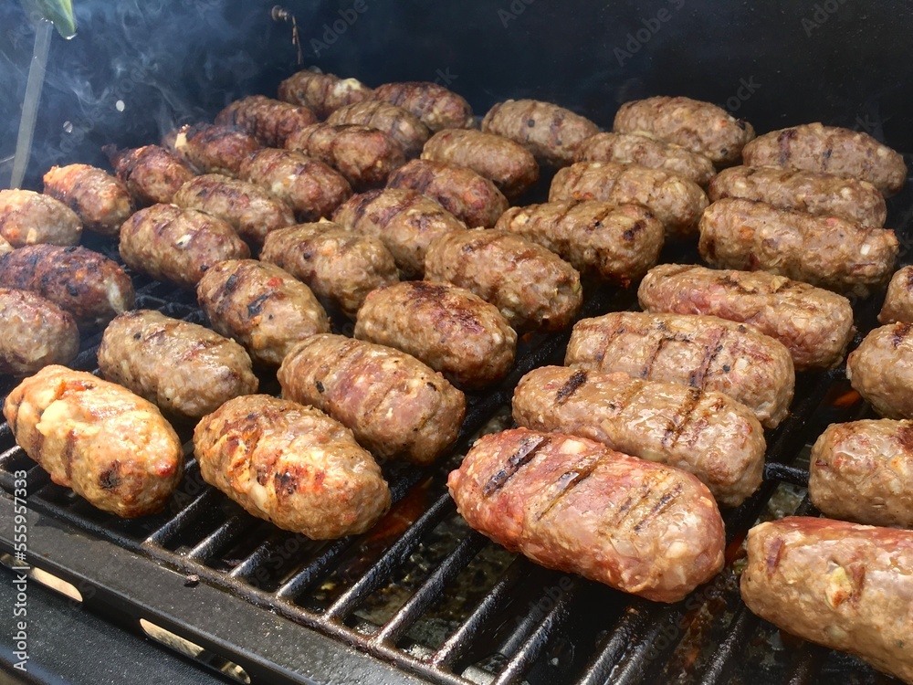 Leskovacki cevapi, small sausage links on a grill Leskovacki cevapi, small sausage links on a grill
