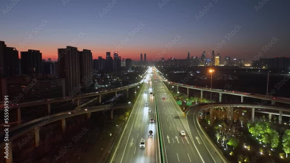 Aerial top view photo of highway multilevel junction road in urban at night