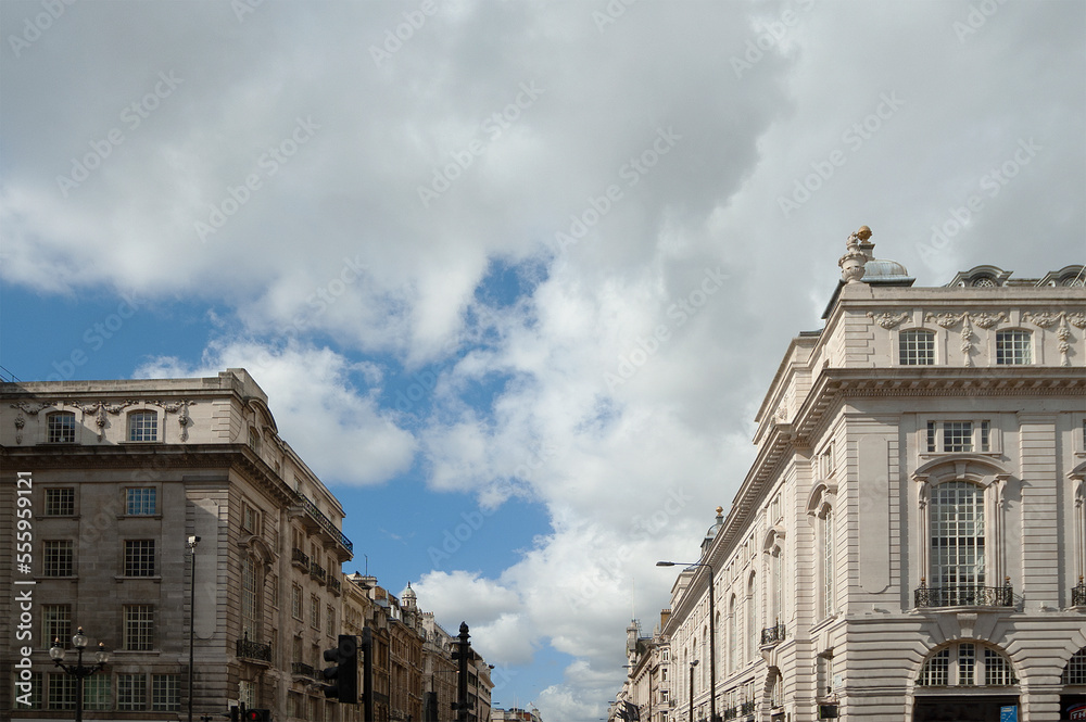 Cloudy skies over central London buildings