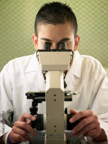 Scientist Using Microscope photo