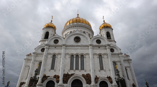 The Cathedral of Christ the Savior in Moscow against the background of gray clouds in the sky.