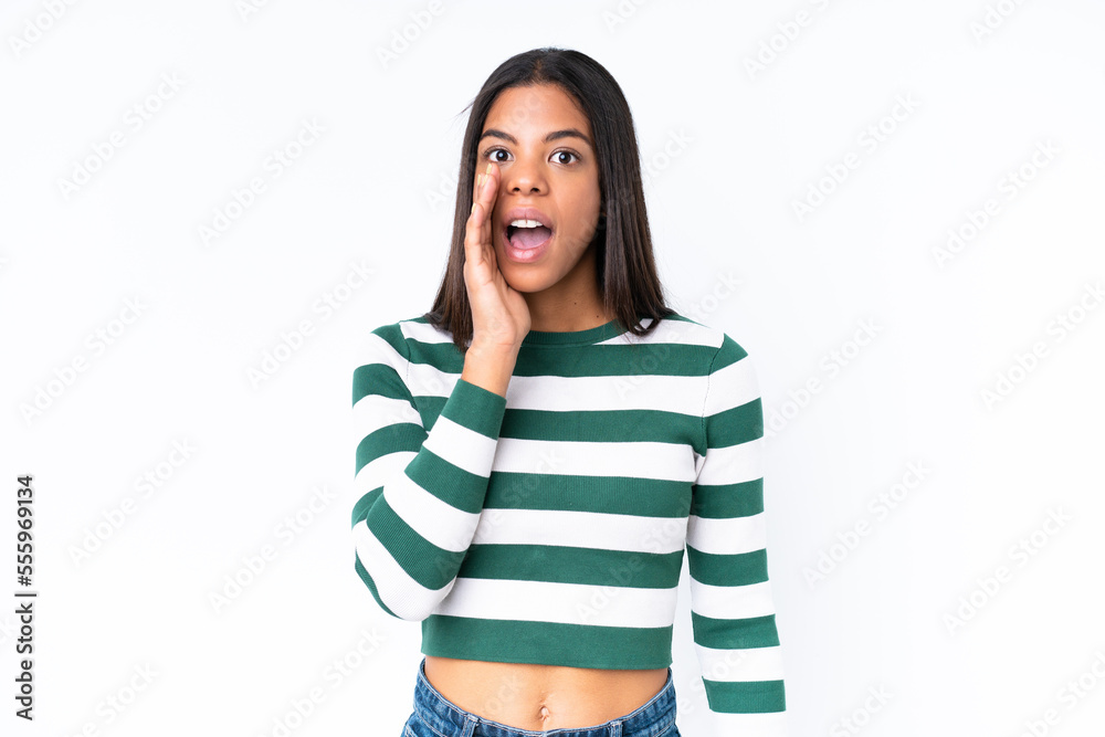 Young African American woman isolated on white background with surprise and shocked facial expression